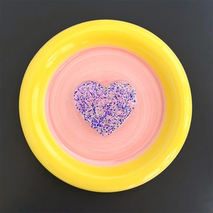 Detail of heart-shaped glitter phone socket with purple and blue sparkling resin finish