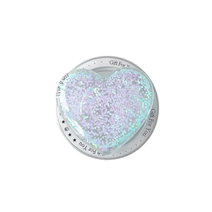 Glittery heart MagSafe phone grip with holographic sequins on a white circular base