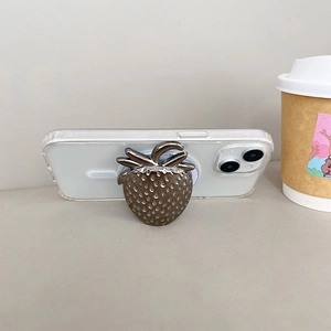 Metallic heart strawberry MagSafe phone grip on clear case with bronze plated finish