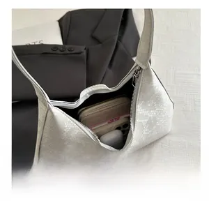 Top view of white snakeskin texture bag showing large capacity for phone and wallet