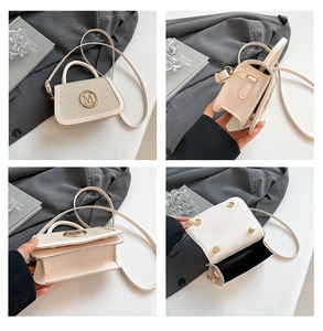 Macro detail of straw texture and gold M logo on cream beige crossbody handbag