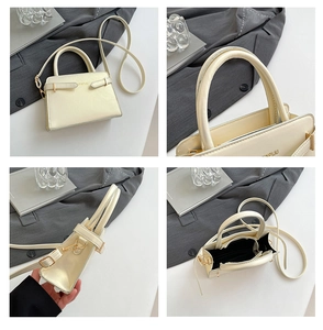 Detail van crème mini-handtas met lychee-korrelstructuur en gouden metalen accessoires