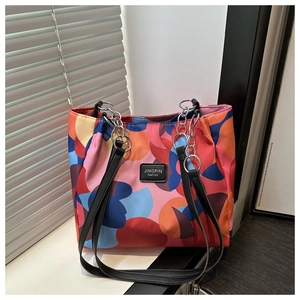 Detail of colorful geometric pattern tote bag with metal chain and JINGPIN leather logo