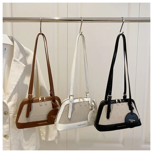 Detailed comparison of three color-block canvas tote bags with leather trim and gold zippers
