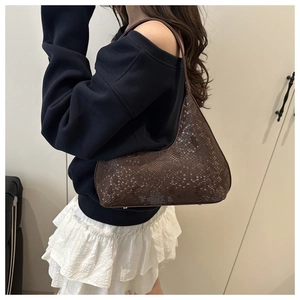 Detail view of the brown snakeskin pattern texture on this elegant faux leather tote bag