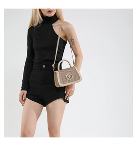 Detail of beige woven crossbody bag with leather trim and round gold metal logo buckle