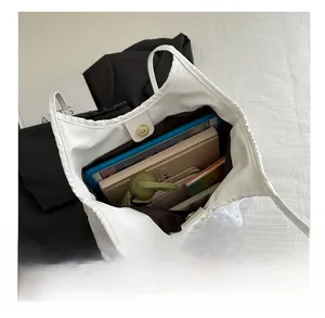 Internal view showing large capacity for tablet and umbrella in white lace tote bag