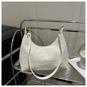 Detailed close-up showing the intricate woven texture of this white PU leather underarm bag