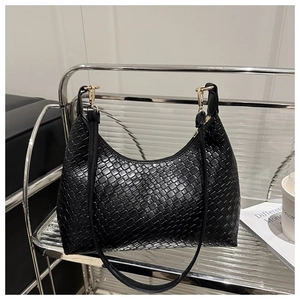 Detailed view of a chic black woven PU leather hobo handbag on a modern glass display rack
