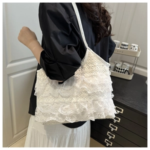 Detail view of a white multi-layered lace ruffle shoulder bag for women's daily commute