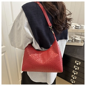 Red woven PU leather underarm hobo bag with adjustable strap shown on model