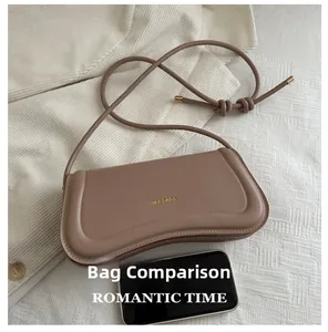 Size comparison showing minimalist beige crossbody bag next to a smartphone