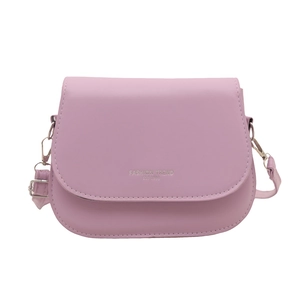 Lavender faux leather saddle bag with silver metal buckle and adjustable strap on white