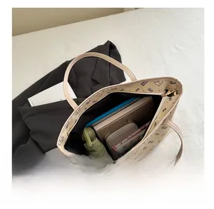 Detailed internal view of beige bear print tote bag showing large storage capacity