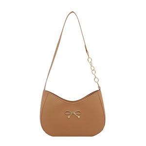 Light brown hobo underarm bag with gold bow ornament and chain strap detail