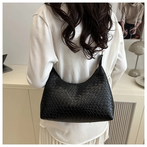 Chic black woven PU leather underarm bag for women, stylish hobo tote bag detail.