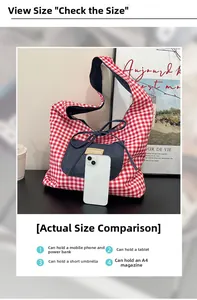 Detail showing red and white checkered canvas tote capacity for tablet and A4 magazines