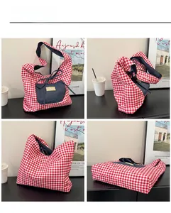 Macro view of checkered canvas tote with denim patchwork pocket and drawstring detail