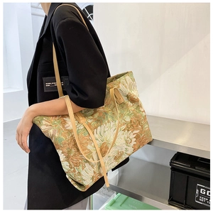 Detail view of artistic oil painting tote bag on shoulder showing large capacity size