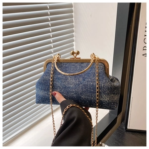 Vintage style denim shell clutch bag with sparkling dots and golden chain strap detail