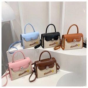 Collection of color-block canvas and leather Kelly bags in five elegant hues