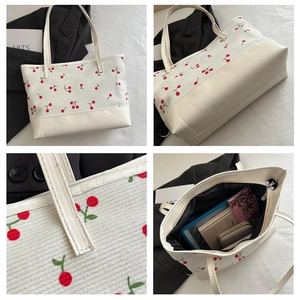 Détail du sac cabas à fleurs avec motif cerise, fermeture éclair et intérieur spacieux