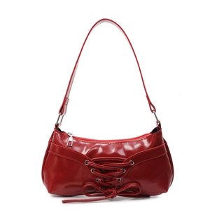 Chic red patent leather Y2K shoulder bag with lace-up detail and decorative bow