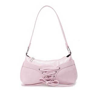 Pale pink shoulder bag with bow detail and lace-up design in a sweet punk style