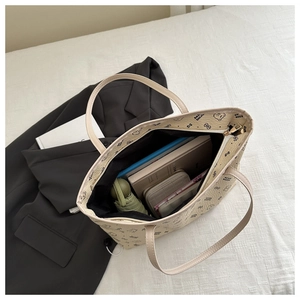Spacious tote bag interior showing capacity for tablet, umbrella, and daily essentials