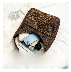 Internal view of leopard print tote bag showing large capacity for tablet and phone