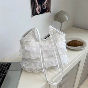 White lace shoulder bag with three-layer ruffles and minimalist handles for daily commute
