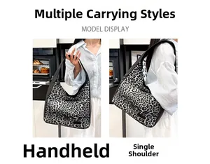 Detail view of the vintage leopard print tote bag showing handheld and shoulder styles