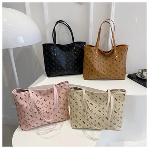 Detail of four patterned tote bags in black, brown, pink, and beige with reinforced handles