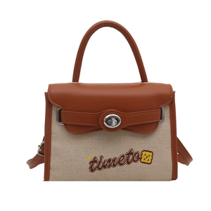 Retro contrast color crossbody Kelly bag with canvas stitching and rotating metal lock