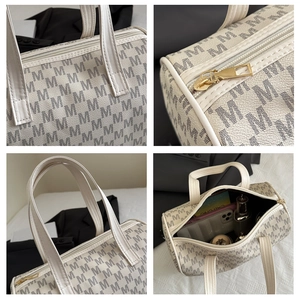 Dettagli della borsa con monogramma M con cerniera dorata e interno spazioso e capiente