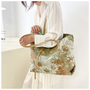 Detail of vintage sunflower jacquard tote bag with large capacity and brown PU straps