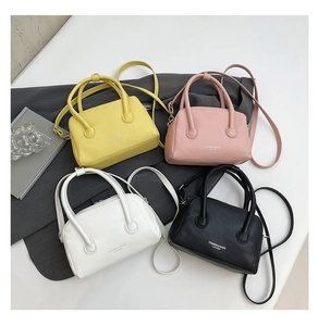 Chic leather crossbody bags in four colors with polished silver hardware and top handles
