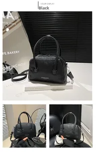 Close-up of black lychee grain leather handbag featuring dual handles and silver hardware
