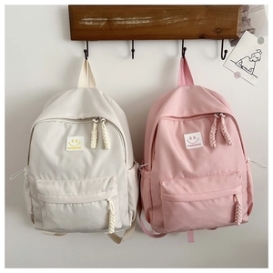 Détails de sacs à dos minimalistes beige et rose avec broderie smiley et tirettes tissées