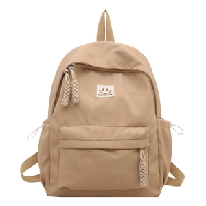 Minimalist light khaki nylon leisure backpack with front pocket and smiley face logo