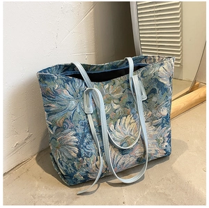 Close-up of vintage oil painting style tote bag with floral jacquard texture
