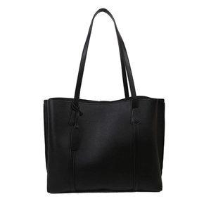 Minimalist large black faux leather tote bag with long shoulder straps for daily commute