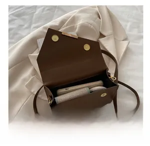 Interior view of leopard print shoulder bag showing space for phone and wallet