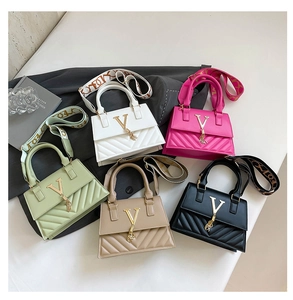 Flat lay of colorful quilted crossbody bags with tassel detail and wide woven straps