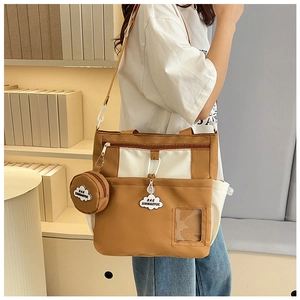 Detail of canvas tote bag with round coin purse and transparent card slot accessory