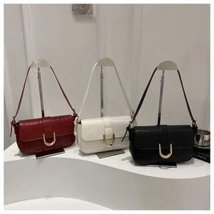 Three crocodile embossed PU leather shoulder bags in red white and black with gold U-locks
