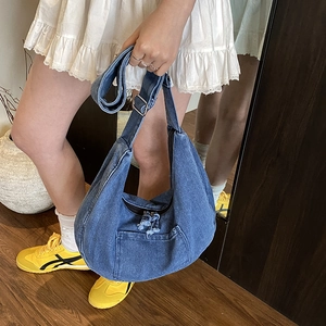 Japanese style dark blue denim crescent crossbody bag with adjustable strap and front pocket