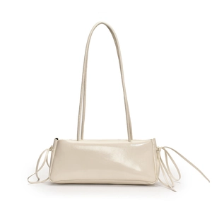 Chic beige patent leather underarm bag with long straps and stylish bow tie accents