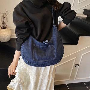 Japanese style deep blue denim hobo bag featuring retro pockets and a frayed edge design