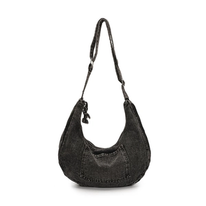 Black denim hobo bag with adjustable strap and front pocket on a white background